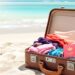A beach scene with a suitcase and passport.
