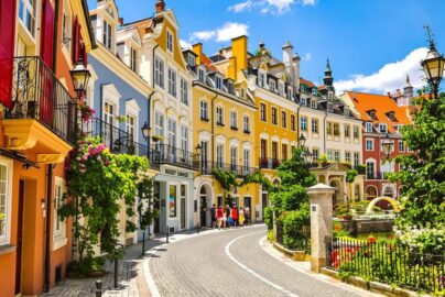 Vibrant European cityscape with affordable travel icons.