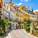 Vibrant European cityscape with affordable travel icons.