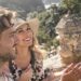 Couple enjoying a scenic view during a budget getaway.