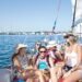 Family enjoying a sunny day sailing in Newport harbor.