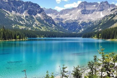 Serene German lake surrounded by lush green mountains.