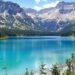 Serene German lake surrounded by lush green mountains.