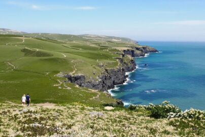 Couple enjoying a scenic UK coastal walk.