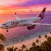 Virgin Atlantic plane flying over a tropical beach at sunset.