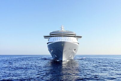 Modern cruise ship sailing on blue ocean
