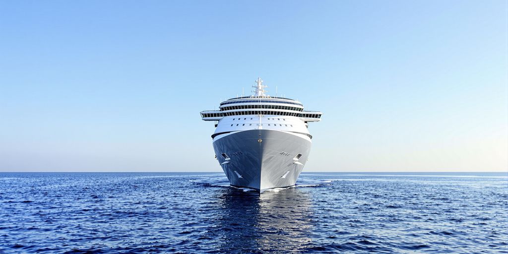 Modern cruise ship sailing on blue ocean