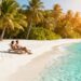 Couple relaxing on a sunny beach, last minute holiday.