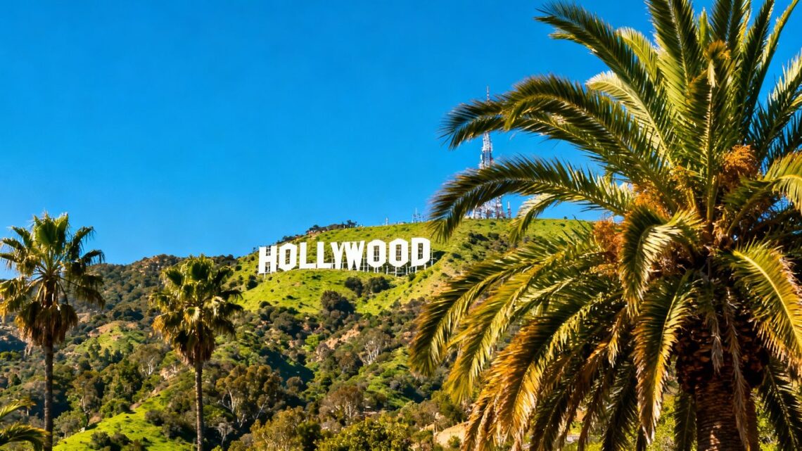 Hollywood sign with palm trees and blue sky