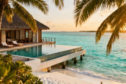 Maldives overwater bungalow with infinity pool and turquoise lagoon.