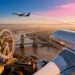 London skyline with airplane flying towards Europe.