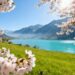 April spring adventure destinations with blossoms and mountains.