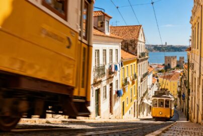 Lisbon's Tram 28 on a sunny street.