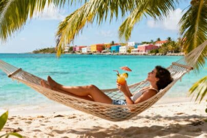 Tropical beach with hammock and ocean view.