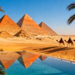 Pyramids of Giza with resort pool and palm trees.