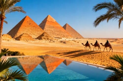 Pyramids of Giza with resort pool and palm trees.